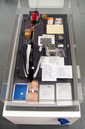 BPL-001 Mission (Conrad Carpenter Funeral), 2007, waterproof case with objects comprising near space vehicle, aluminum, nylon, polycarbonate, dacron, mylar, electronics, steel, brass, paper, urethane, 6 x 53 x 16 inches (15 x 135 x 40.5 cm)